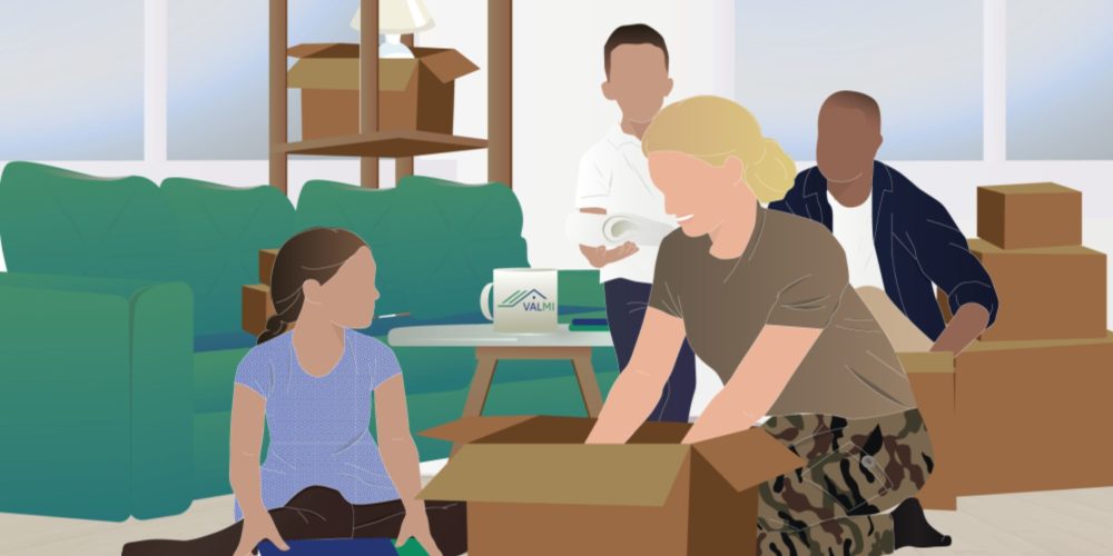 Une famille en train de préparer les cartons de déménagements